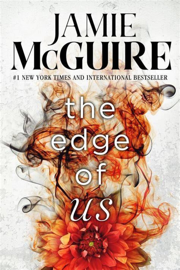 author jamie mcguire surronding by books she wrote